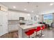 Bright kitchen with a large island, stainless steel appliances, and modern finishes at 112 Leveret Rd, Locust Grove, GA 30248