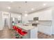 Bright kitchen with a large island, stainless steel appliances, and modern finishes at 112 Leveret Rd, Locust Grove, GA 30248