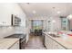 Bright kitchen with stainless steel appliances and a dining area at 112 Leveret Rd, Locust Grove, GA 30248