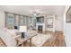Comfortable living room featuring a fireplace, TV, and hardwood floors at 112 Leveret Rd, Locust Grove, GA 30248