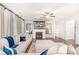 Comfortable living room featuring a fireplace, TV, and hardwood floors at 112 Leveret Rd, Locust Grove, GA 30248