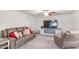 Comfortable living room featuring neutral walls, carpet, and stylish furniture at 112 Leveret Rd, Locust Grove, GA 30248