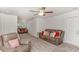Spacious living room with neutral carpet and brown leather sofas at 112 Leveret Rd, Locust Grove, GA 30248