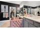 Luxurious bathroom with dual sinks, walk-in closet, and black accent wall at 1127 Provence Ln, Decatur, GA 30033
