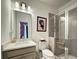 Modern bathroom with a glass shower, and a vanity with a white countertop, designed for relaxation at 1127 Provence Ln, Decatur, GA 30033