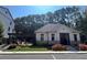 Clubhouse exterior with stone accents, a covered entrance, and well-maintained landscaping at 1127 Provence Ln, Decatur, GA 30033