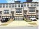 Charming townhomes feature private garages and welcoming entrances with landscaped stairs at 1127 Provence Ln, Decatur, GA 30033