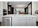 Spacious kitchen with stainless steel dishwasher and large island looking into other rooms at 1127 Provence Ln, Decatur, GA 30033