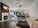 Bright living room with large windows, a fireplace, and a comfortable white sofa at 1127 Provence Ln, Decatur, GA 30033