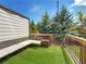 View of private patio with artificial turf, bench seating, and a small side yard at 1127 Provence Ln, Decatur, GA 30033