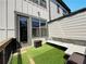 Cozy patio with artificial grass, outdoor seating, and a stylish design for relaxation and entertainment at 1127 Provence Ln, Decatur, GA 30033