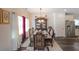 Elegant dining room featuring a beautiful chandelier and ample natural light at 2209 Cedar Place Ct, Snellville, GA 30078
