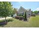 Well-maintained home with lush landscaping, showcasing its curb appeal and charm at 2209 Cedar Place Ct, Snellville, GA 30078