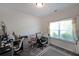 Well-lit home office with a large window, desk, and comfortable office chair at 2209 Cedar Place Ct, Snellville, GA 30078