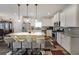 Modern kitchen featuring white cabinets, stainless steel appliances, and a large island at 2209 Cedar Place Ct, Snellville, GA 30078