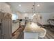 Updated kitchen with granite countertops, stainless steel appliances and modern lighting at 2209 Cedar Place Ct, Snellville, GA 30078
