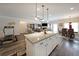 Open concept kitchen featuring granite counters, island with pendant lighting, and stainless appliances at 2209 Cedar Place Ct, Snellville, GA 30078