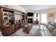 Comfortable living room featuring a fireplace, built-in shelving, and stylish furnishings at 2209 Cedar Place Ct, Snellville, GA 30078