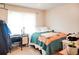 Inviting bedroom featuring comfortable bedding, a desk area, and a bright window at 2621 Manor Pl, Ellenwood, GA 30294