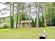 Traditional single-story home with a spacious front lawn, mature trees, and a welcoming entrance at 2621 Manor Pl, Ellenwood, GA 30294