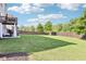 Spacious backyard with lush green lawn and wooden fence at 2793 Bloom Cir, Dacula, GA 30019