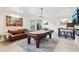 Another view of the basement's pool table and seating area with modern decor at 2793 Bloom Cir, Dacula, GA 30019