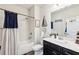 Charming bathroom featuring a shower/tub combination and dark vanity with white countertop at 2793 Bloom Cir, Dacula, GA 30019