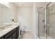 Bathroom with vanity, toilet, and glass shower enclosure, granite countertop, and tile floors at 2793 Bloom Cir, Dacula, GA 30019