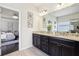 Bathroom featuring double sink vanity and shower with frameless glass doors at 2793 Bloom Cir, Dacula, GA 30019