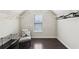 Walk-in closet with window features built-in shelves, rod, and cushioned chair at 2793 Bloom Cir, Dacula, GA 30019
