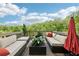 Spacious outdoor deck with comfortable seating and a view of the surrounding trees at 2793 Bloom Cir, Dacula, GA 30019