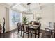 Elegant dining room with coffered ceiling and dark hardwood floors at 2793 Bloom Cir, Dacula, GA 30019