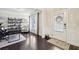 Inviting entryway featuring dark hardwood floors and a view into the home office at 2793 Bloom Cir, Dacula, GA 30019