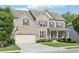 Attractive two-story brick home featuring a basketball hoop on the driveway and a well-maintained lawn at 2793 Bloom Cir, Dacula, GA 30019