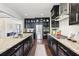 Well-equipped kitchen with a large island, granite countertops, dark cabinetry, and stainless steel appliances at 2793 Bloom Cir, Dacula, GA 30019