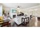 Spacious living room with a fireplace, piano, hardwood floors, and ample seating for relaxation and entertainment at 2793 Bloom Cir, Dacula, GA 30019