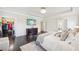 Spacious main bedroom featuring a tray ceiling, hardwood floors, and view to closet at 2793 Bloom Cir, Dacula, GA 30019