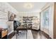 Bright office with hardwood floors, white brick accent wall, white trim, and bright window at 2793 Bloom Cir, Dacula, GA 30019