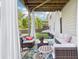 Covered patio area with outdoor seating and view to the yard at 2793 Bloom Cir, Dacula, GA 30019