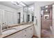 Elegant bathroom featuring double sinks, granite countertops, and a separate shower, offering a luxurious experience at 4620 Wieuca Ne Rd # 42, Atlanta, GA 30342
