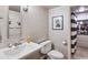 Cozy bathroom featuring white tile, modern fixtures, and stylish art, creating a clean and inviting space at 4620 Wieuca Ne Rd # 42, Atlanta, GA 30342