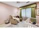Cozy Bedroom features a crib, comfortable chair, and soft colors, perfect for a baby's room at 4620 Wieuca Ne Rd # 42, Atlanta, GA 30342