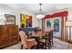 Inviting dining room with hardwood floors, classic furniture, and a colorful artwork, creating a warm ambiance at 4620 Wieuca Ne Rd # 42, Atlanta, GA 30342