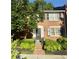 Charming brick townhome with black shutters and a beautifully landscaped front yard at 4620 Wieuca Ne Rd # 42, Atlanta, GA 30342
