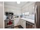 Functional kitchen features stainless steel appliances, white cabinetry, and a practical layout for efficient cooking at 4620 Wieuca Ne Rd # 42, Atlanta, GA 30342