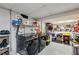 Functional laundry room equipped with front load washer and dryer and ample storage shelving at 4620 Wieuca Ne Rd # 42, Atlanta, GA 30342