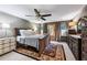 Spacious main bedroom with dark wood furniture, soft lighting, and a ceiling fan, creating a tranquil retreat at 4620 Wieuca Ne Rd # 42, Atlanta, GA 30342