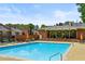 Enjoy a refreshing swim in the community pool, complete with lounge chairs and shaded seating areas at 4620 Wieuca Ne Rd # 42, Atlanta, GA 30342