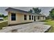 Backyard featuring a patio and the exterior of the house at 1229 Huntington Place Cir, Lithonia, GA 30058