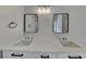 Bathroom features a double sink vanity with modern fixtures and lighting at 1229 Huntington Place Cir, Lithonia, GA 30058